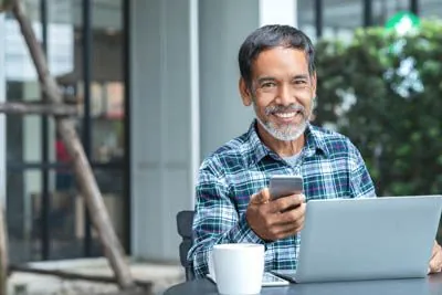 man scheduling a dental appointment at Oregon Wisdom Teeth