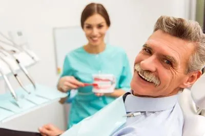 man getting dental implants at Oregon Wisdom Teeth in Salem, OR