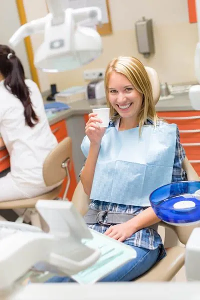 patient about to take an oral sedative before her dental procedure